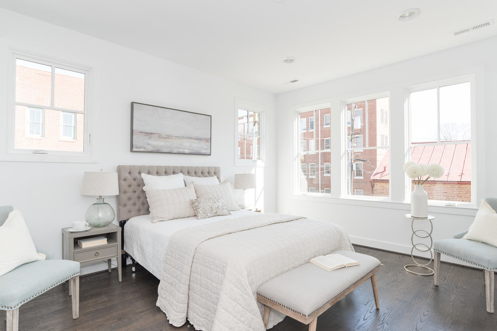 Classic master bedroom in DC Metro with white walls and dark hardwood flooring.