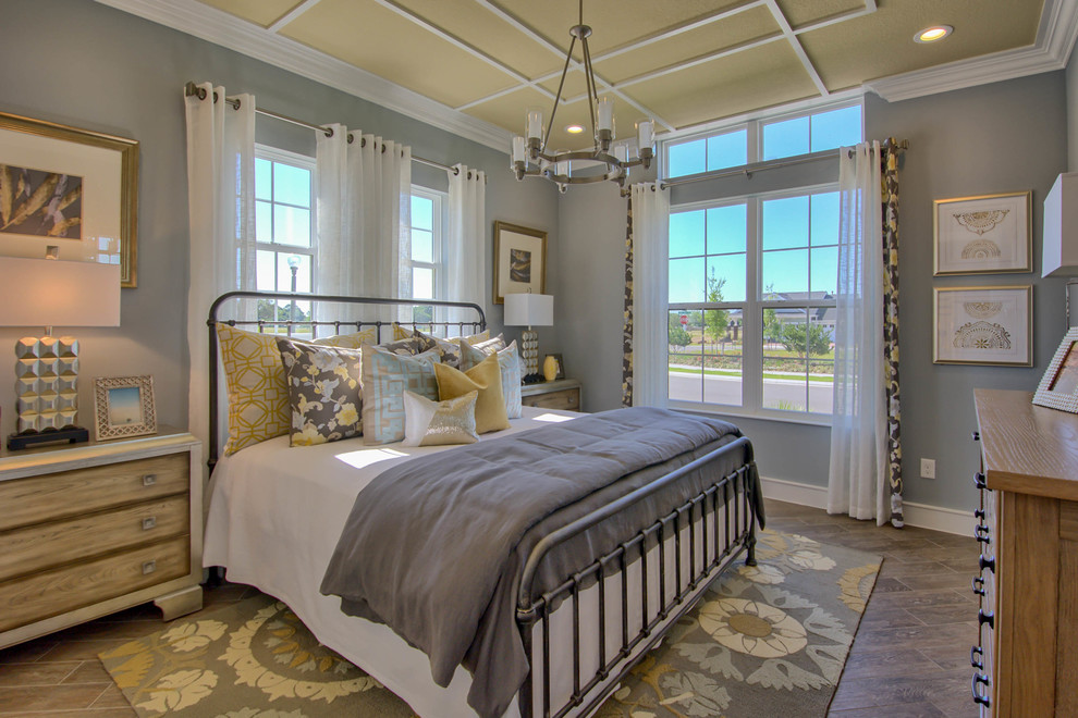 Inspiration for a medium sized mediterranean master bedroom in Orlando with beige walls, porcelain flooring, no fireplace and brown floors.