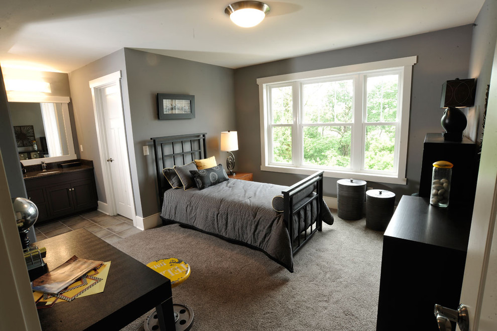 Diseño de habitación de invitados actual con paredes grises, moqueta, con escritorio y suelo gris