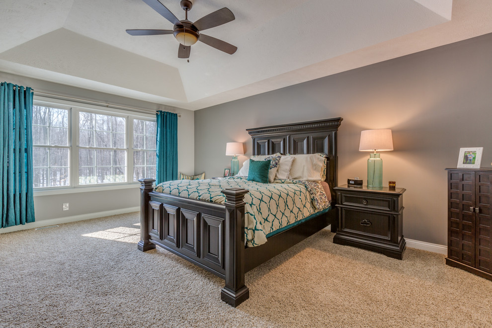Photo of a medium sized traditional master bedroom in Cleveland with grey walls and carpet.