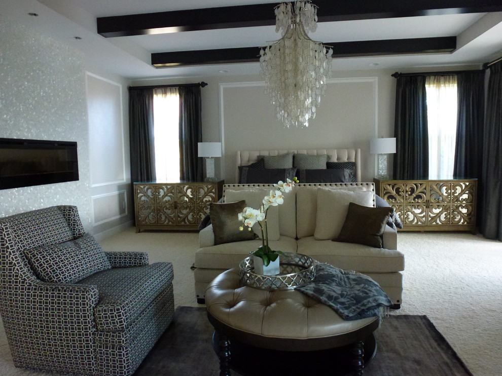 Large eclectic master bedroom in Miami with beige walls, carpet, a standard fireplace and a tiled fireplace surround.