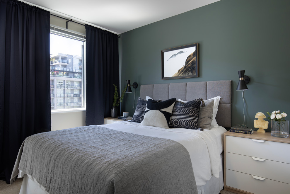 This is an example of a small eclectic master bedroom in Vancouver with green walls.