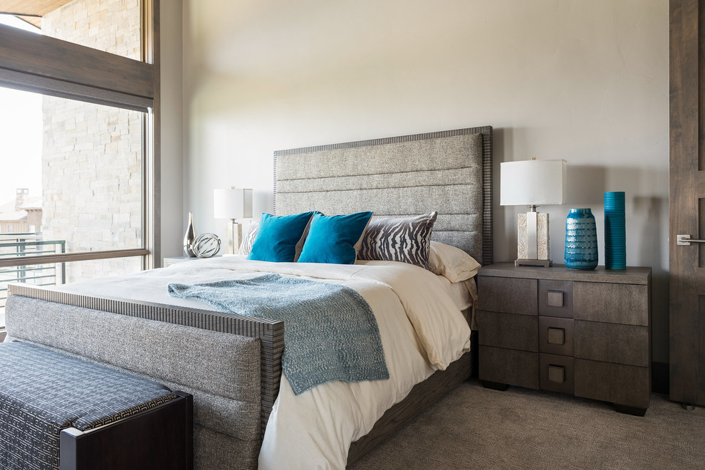 Example of a mountain style master carpeted and beige floor bedroom design in Salt Lake City with beige walls