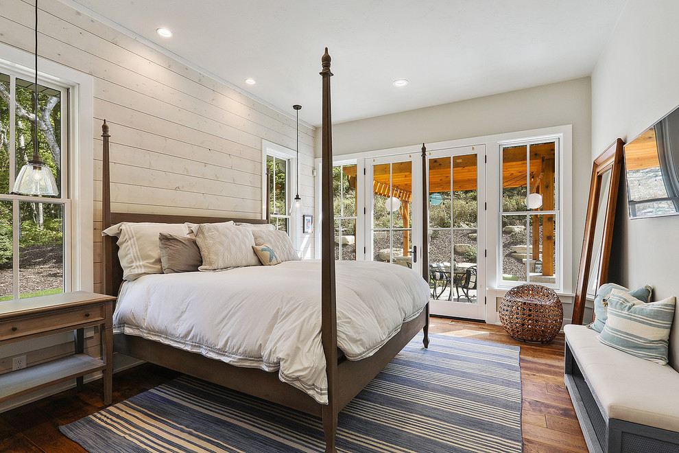 Bedroom - mid-sized coastal guest dark wood floor and brown floor bedroom idea in Other with beige walls and no fireplace