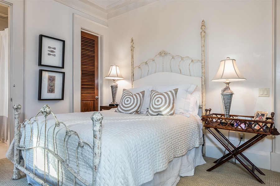 Inspiration for a mid-sized guest carpeted bedroom remodel in Miami with beige walls