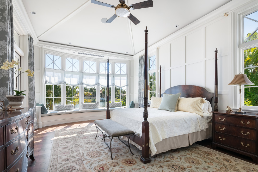 Large beach style master dark wood floor and brown floor bedroom photo in Tampa with white walls and no fireplace