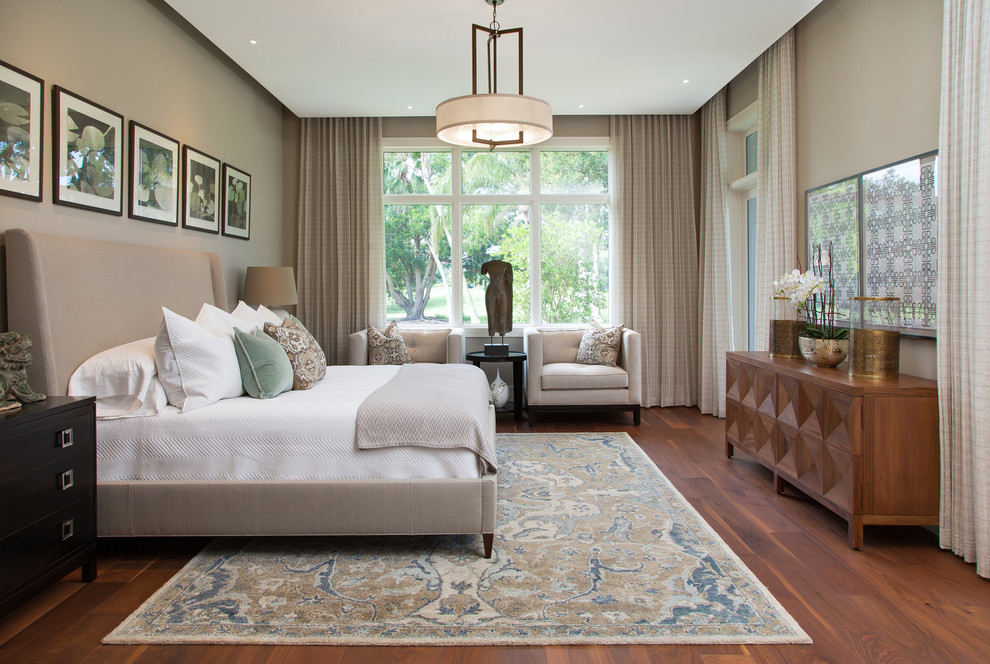 Large traditional master bedroom in Miami with brown walls, dark hardwood flooring, no fireplace and brown floors.