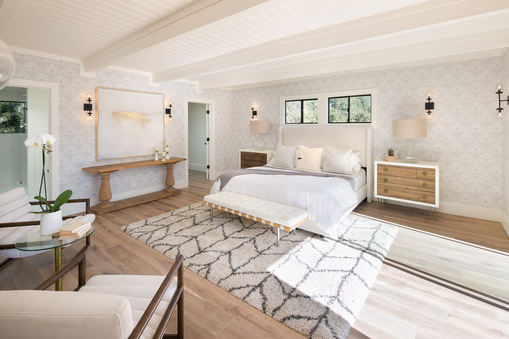 Photo of a large midcentury master bedroom in San Francisco with grey walls, light hardwood flooring and white floors.