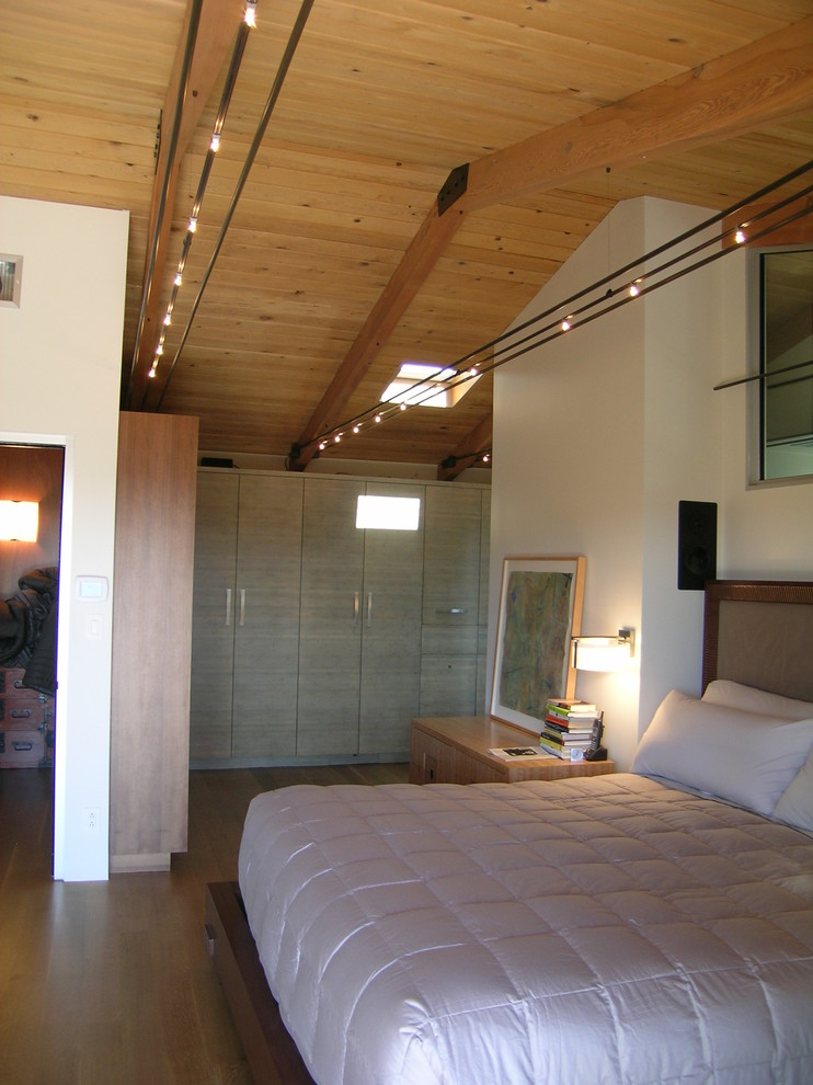 This is an example of a contemporary bedroom in San Francisco with beige walls.