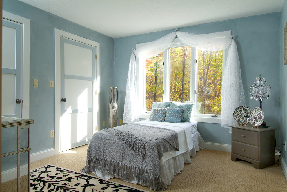Traditional bedroom in Boston with blue walls.