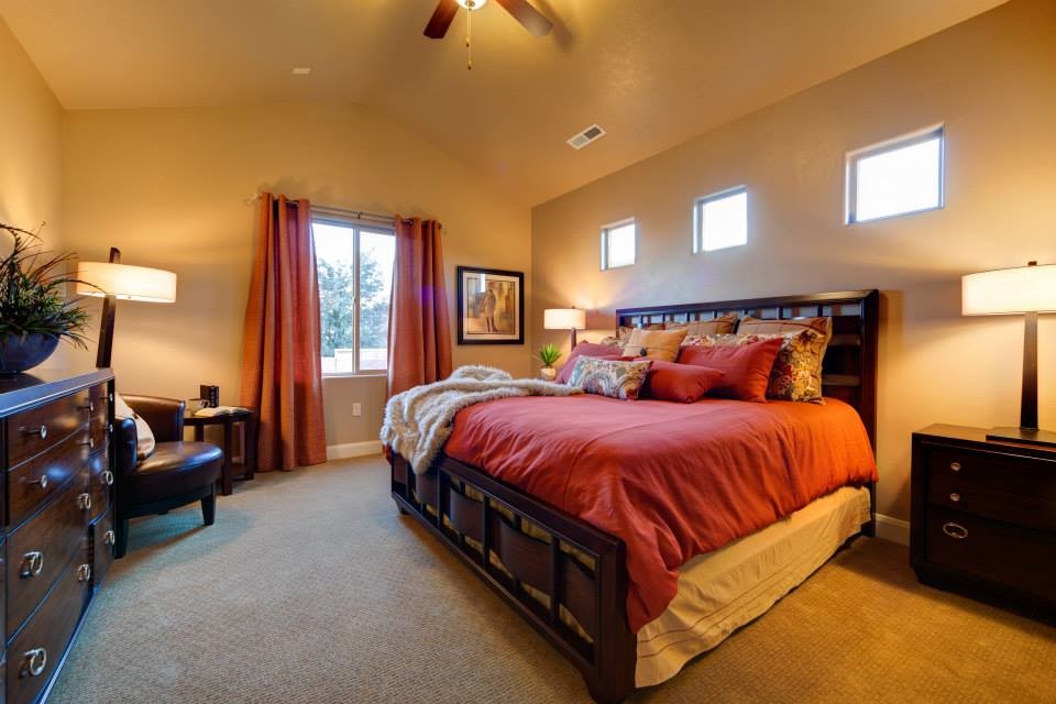Large carpeted bedroom photo in Salt Lake City with beige walls