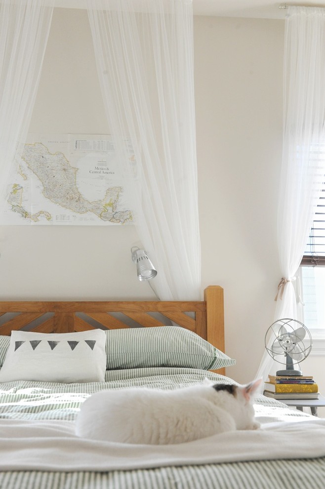 Bedroom - eclectic bedroom idea in Other with beige walls