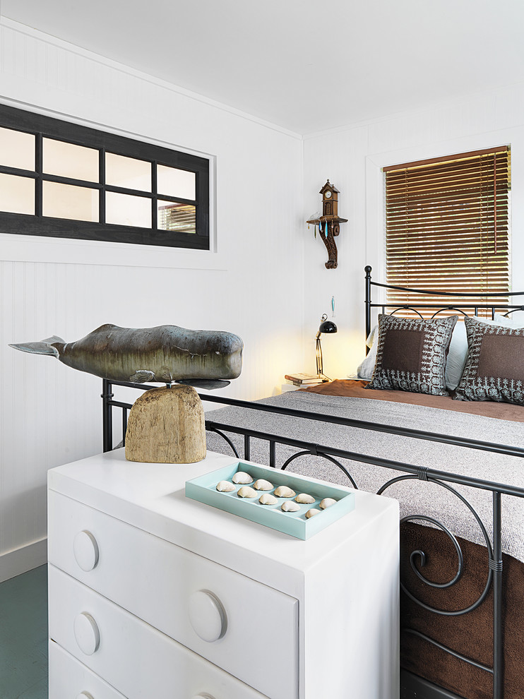 Inspiration for a coastal guest bedroom remodel in Vancouver with white walls