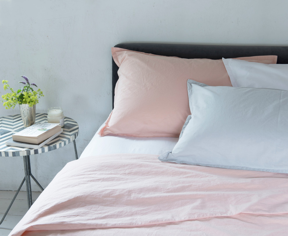 Design ideas for a small scandi grey and pink bedroom in London.