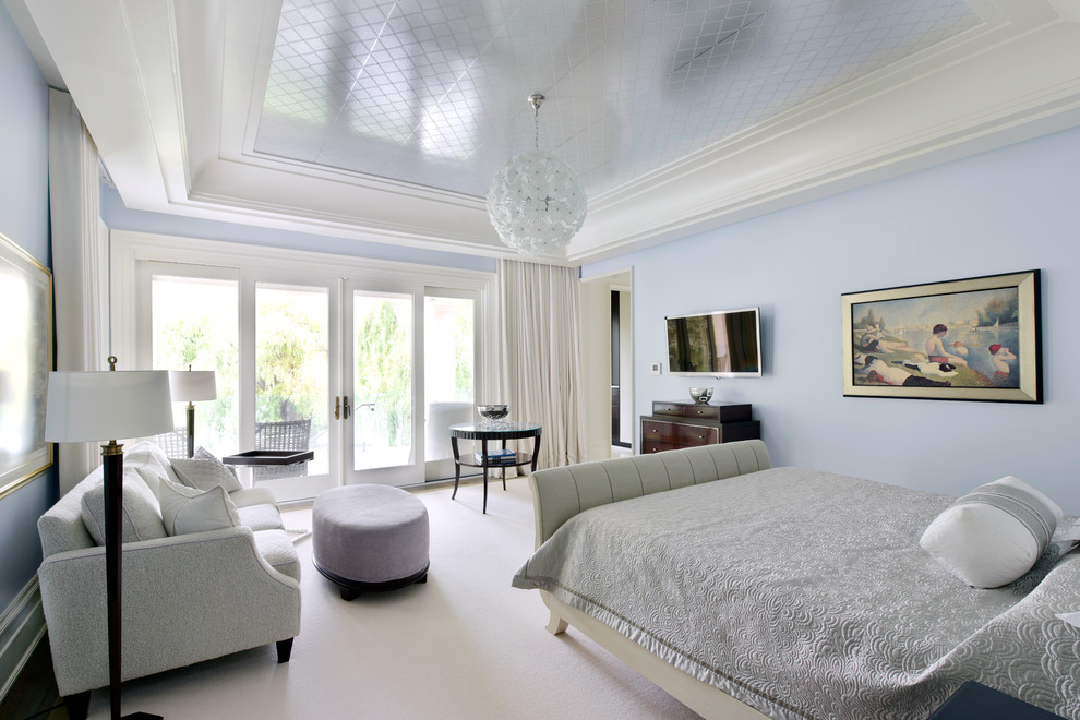 Example of a mid-sized transitional master carpeted bedroom design in Toronto with blue walls