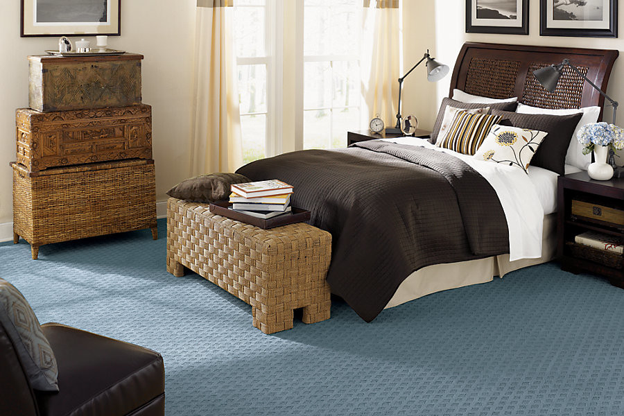 Inspiration for a medium sized modern guest bedroom in Austin with white walls, carpet, no fireplace and blue floors.