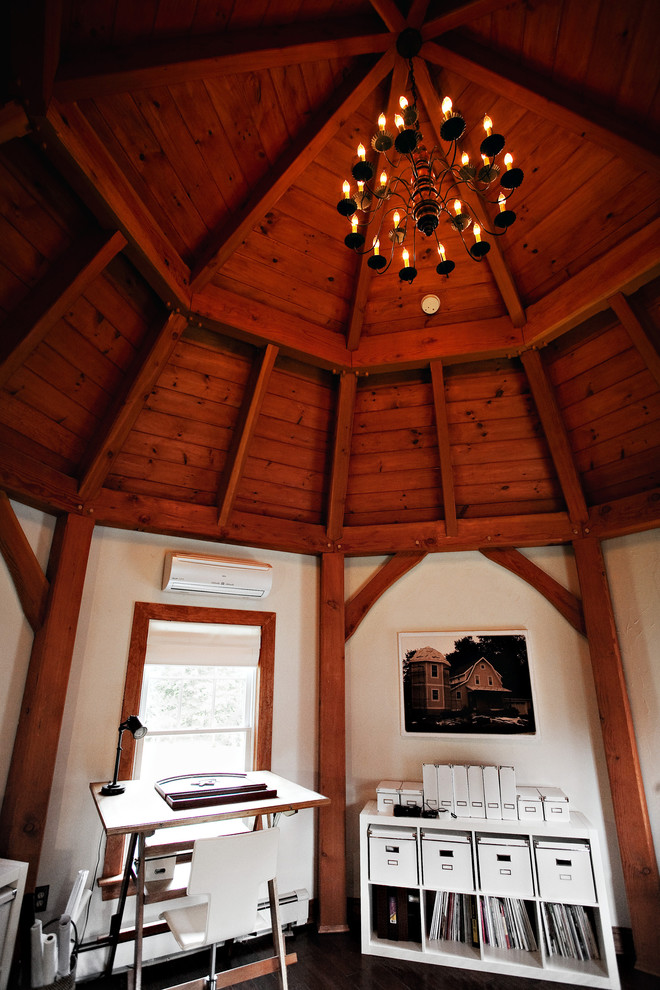 Example of a large country dark wood floor bedroom design in DC Metro with white walls and no fireplace