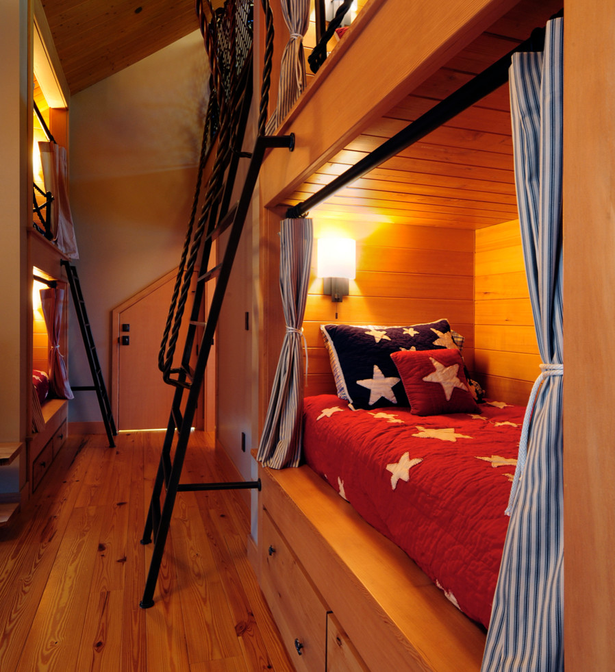 Medium sized traditional mezzanine bedroom in Seattle with brown walls, medium hardwood flooring and brown floors.