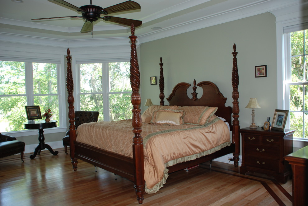 Bedroom - large traditional master light wood floor and tray ceiling bedroom idea in Charleston with green walls and no fireplace