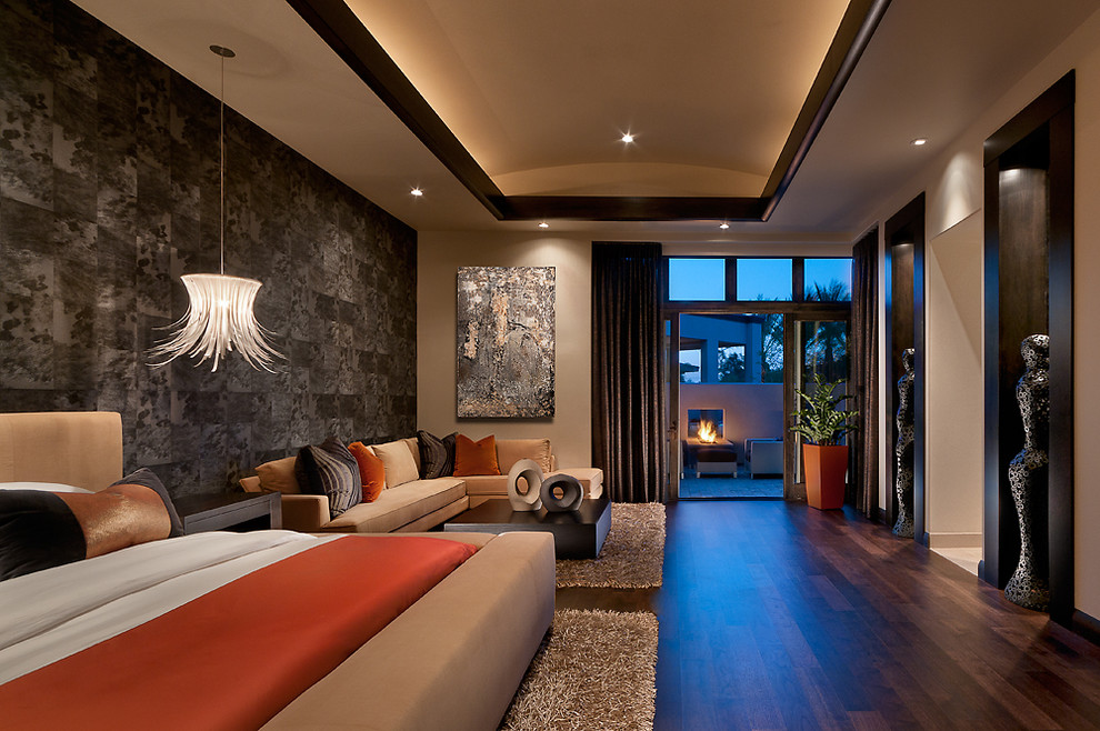 Example of an island style dark wood floor bedroom design in Phoenix with multicolored walls