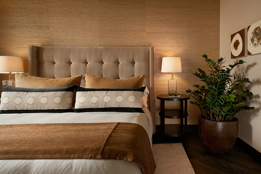 Contemporary bedroom in Phoenix with beige walls, dark hardwood flooring and a feature wall.