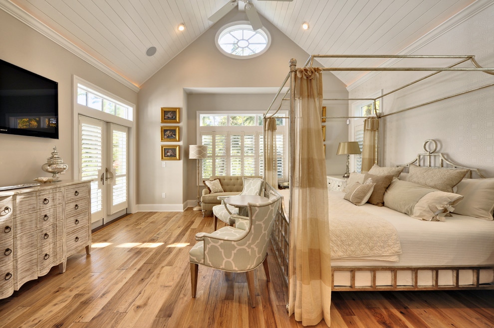 Bedroom - coastal medium tone wood floor bedroom idea in Philadelphia with beige walls