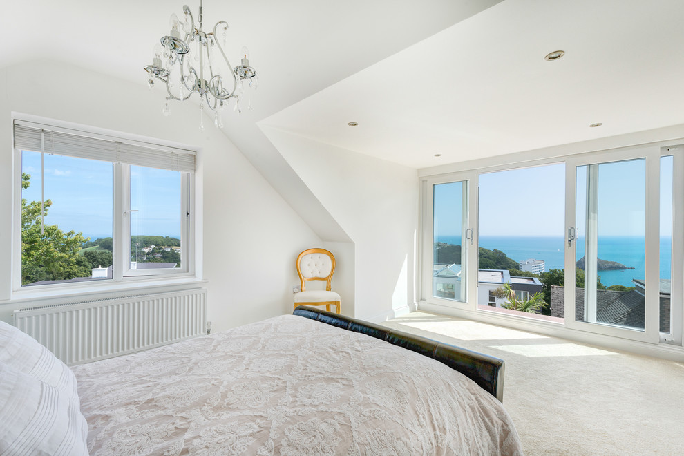 Classic bedroom in Devon with white walls and carpet.