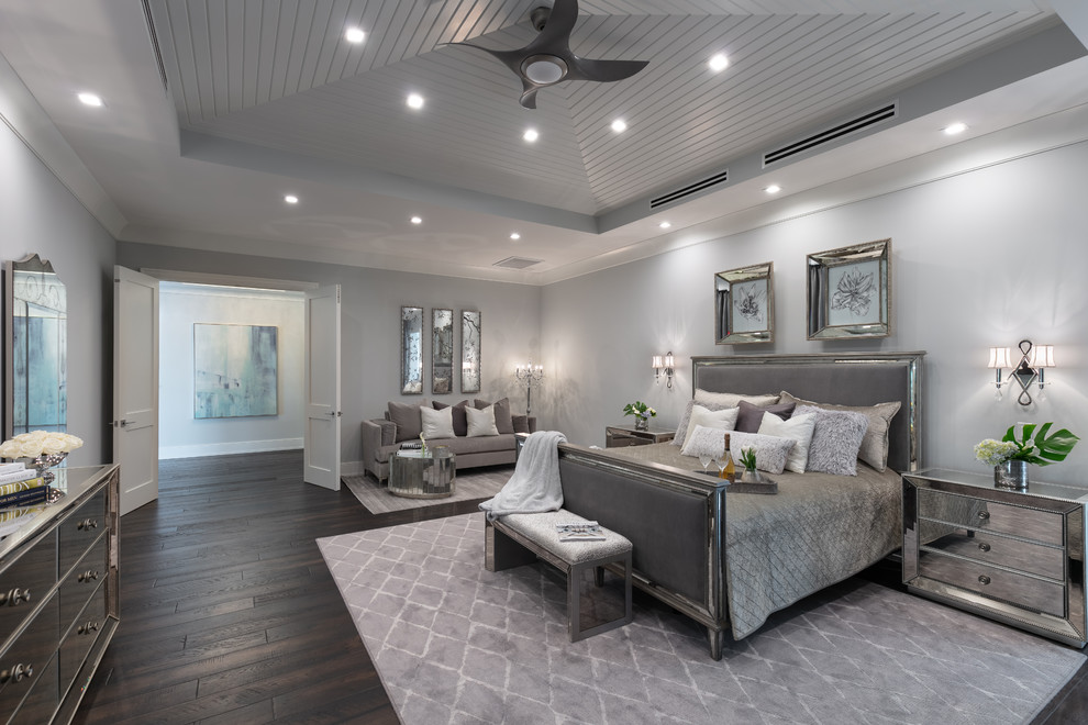 Nautical master and grey and silver bedroom in Tampa with grey walls, dark hardwood flooring and no fireplace.
