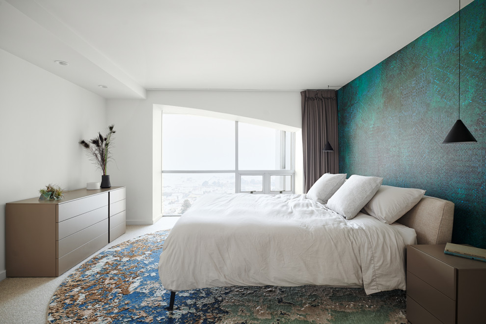 Contemporary bedroom in San Francisco with green walls, carpet, beige floors and wallpapered walls.