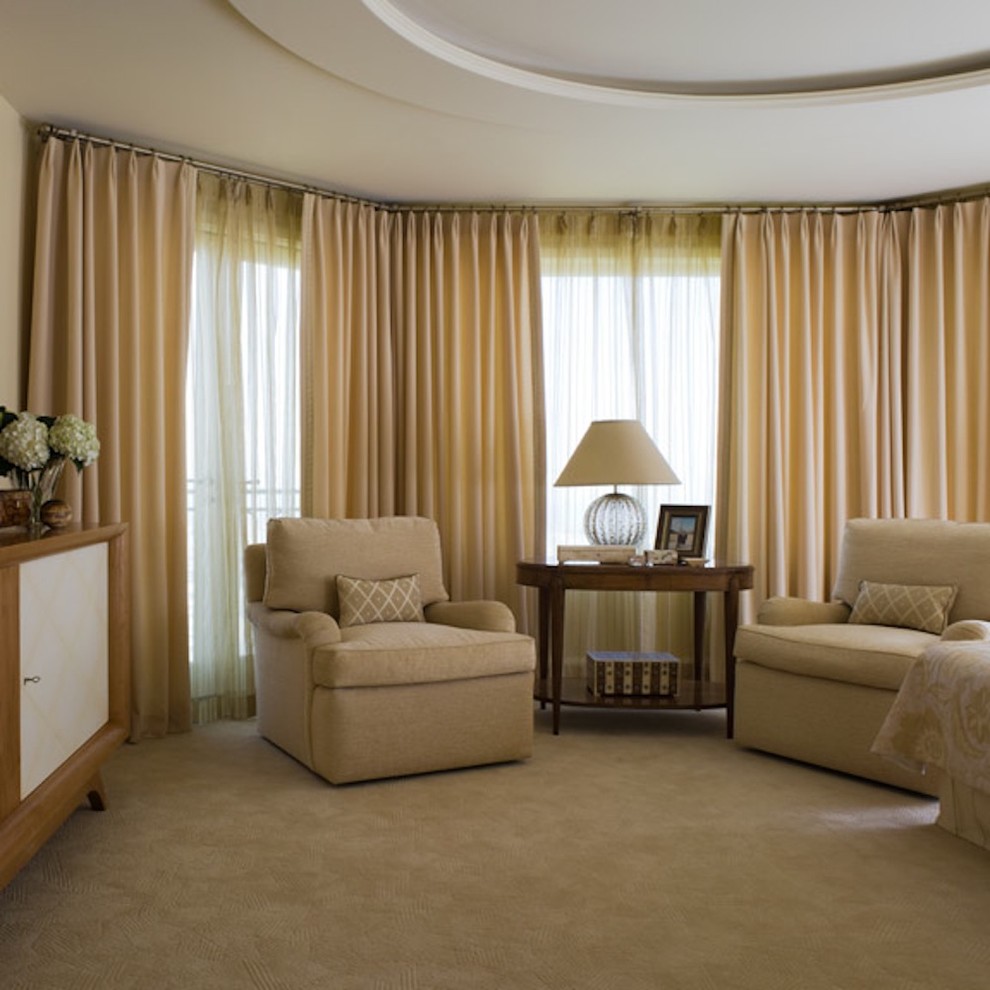 This is an example of a large classic master bedroom in San Francisco with carpet and beige walls.