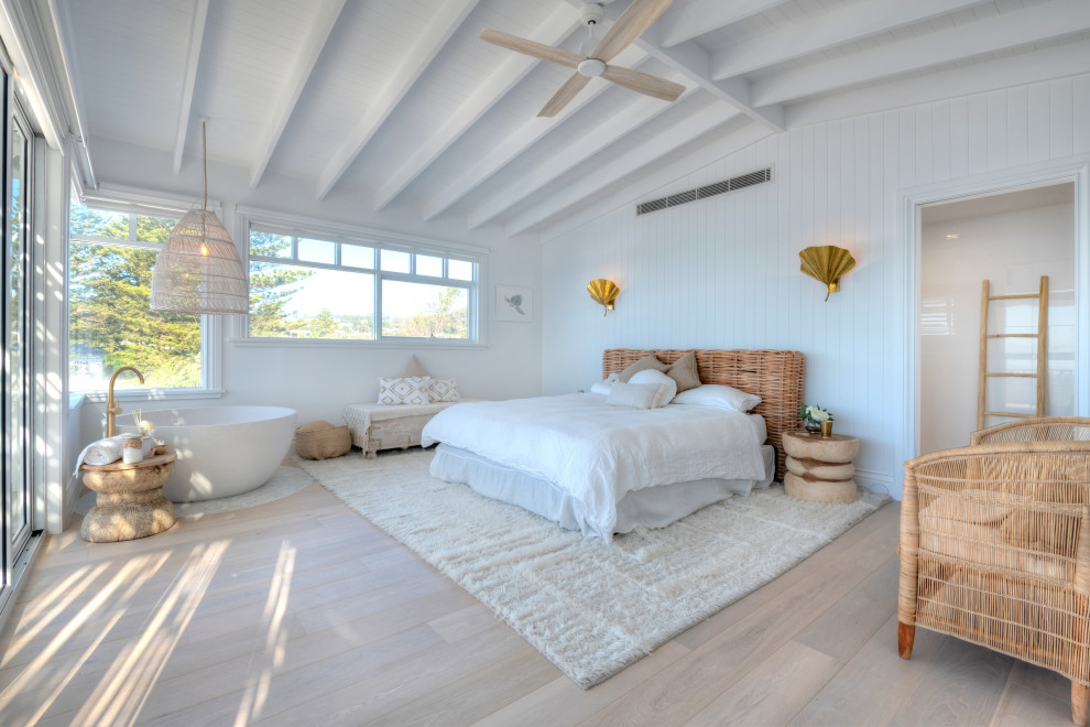 Design ideas for a beach style bedroom in Central Coast.