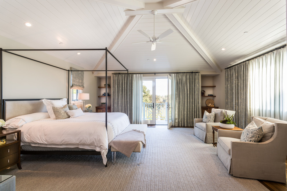 Example of a beach style master bedroom design in Los Angeles with beige walls and no fireplace