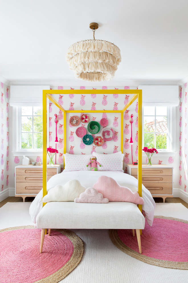 Design ideas for a modern kids' bedroom in New York with pink walls.