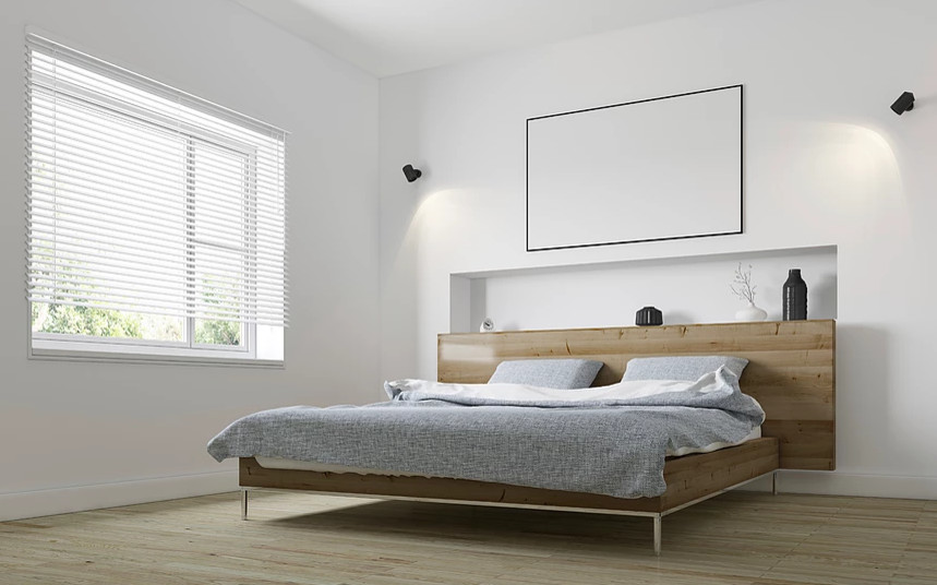 Diseño de habitación de invitados actual de tamaño medio sin chimenea con paredes blancas, suelo de madera clara y suelo marrón