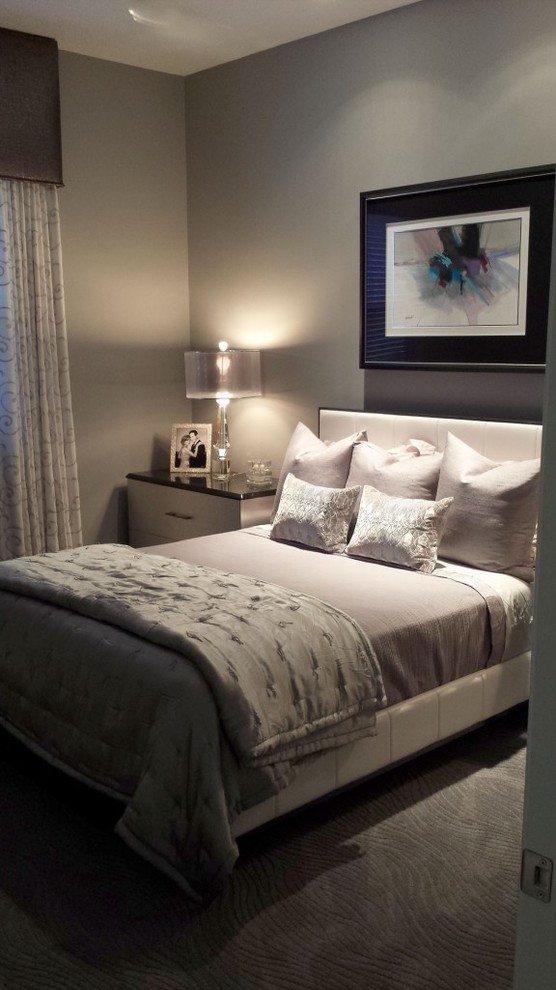 Example of a mid-sized trendy guest carpeted bedroom design in New York with gray walls and no fireplace