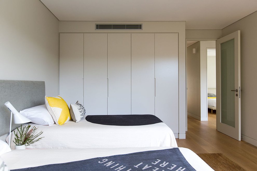 This is an example of a coastal bedroom in Sydney.