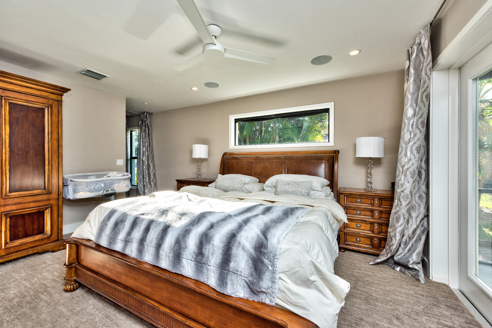 Inspiration for a medium sized classic master bedroom in Miami with brown walls, carpet, no fireplace and brown floors.