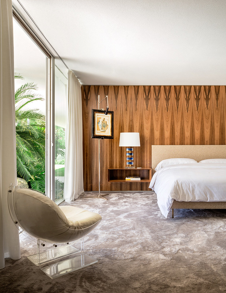 This is an example of a midcentury grey and brown bedroom in New York with brown walls, carpet and grey floors.