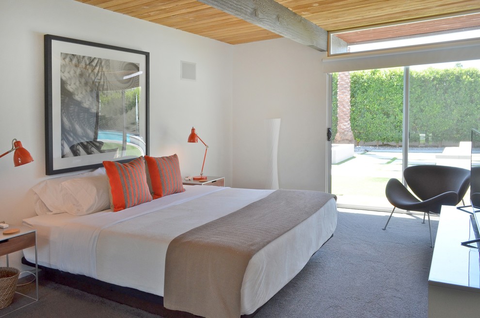Example of a mid-sized trendy guest carpeted bedroom design in Los Angeles with white walls and no fireplace