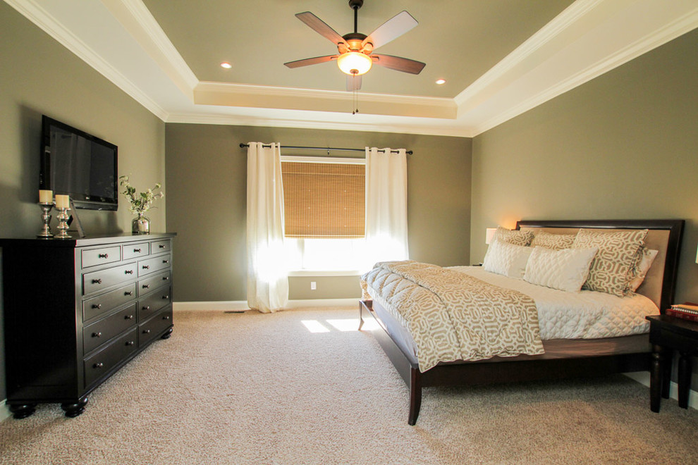 Design ideas for a large traditional master bedroom in Nashville with green walls, carpet and beige floors.