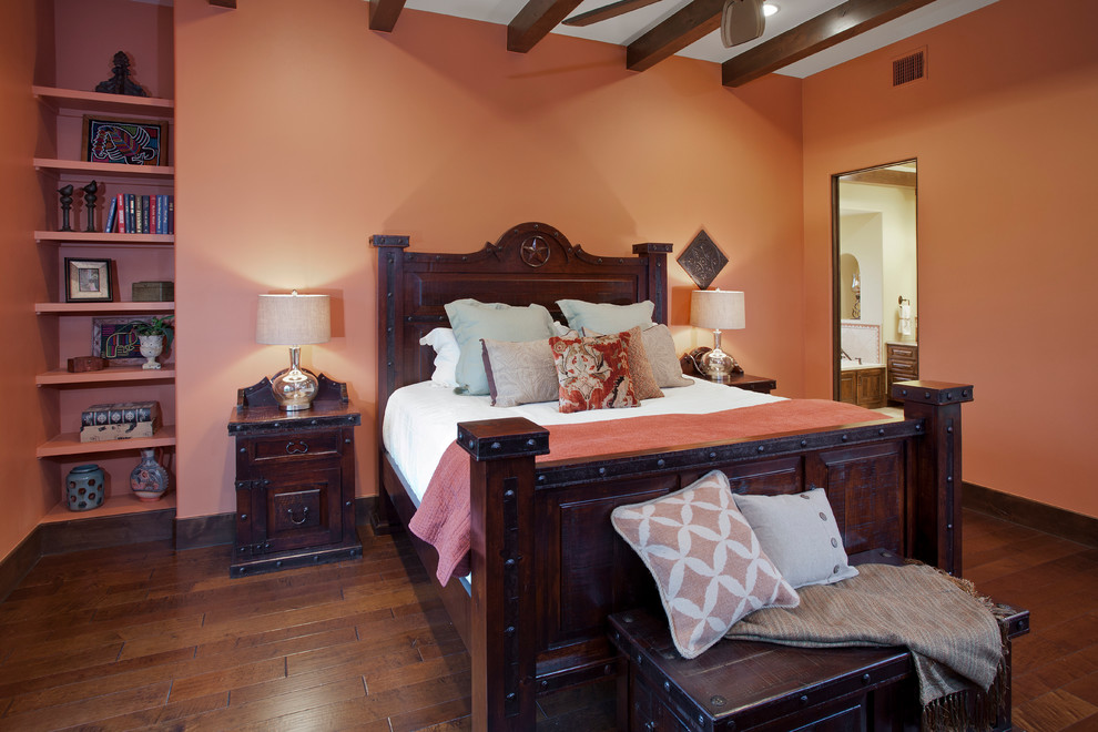 Design ideas for a bedroom in Austin with pink walls and dark hardwood flooring.