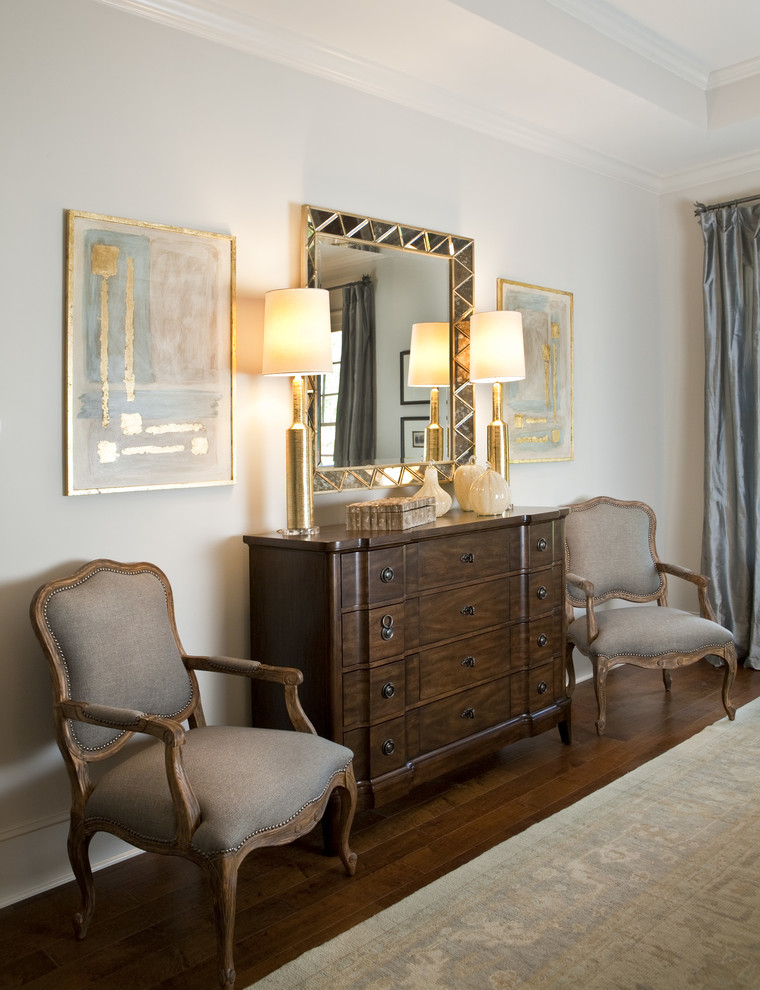 Photo of a traditional master bedroom in Charlotte with grey walls and dark hardwood flooring.