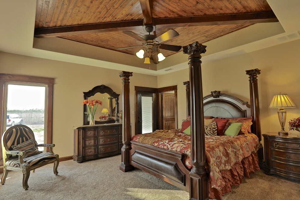 Inspiration for a mid-sized mediterranean master carpeted bedroom remodel in Dallas with beige walls and no fireplace