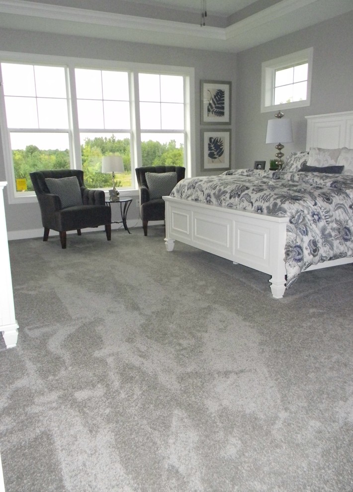 This is an example of a traditional bedroom in Minneapolis with carpet.
