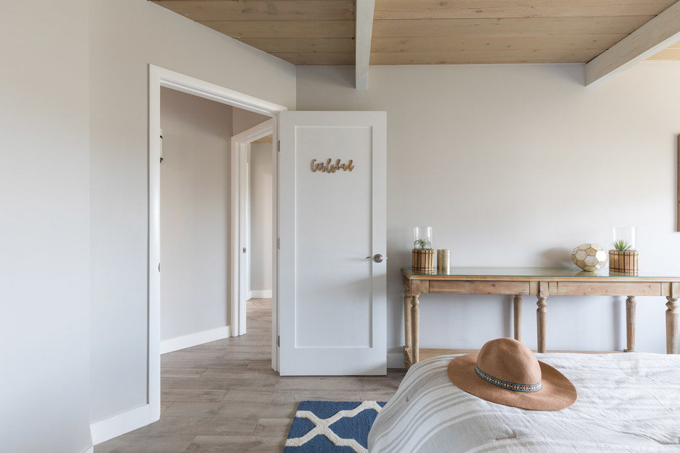 Design ideas for a medium sized nautical guest bedroom in San Diego with grey walls, vinyl flooring and brown floors.