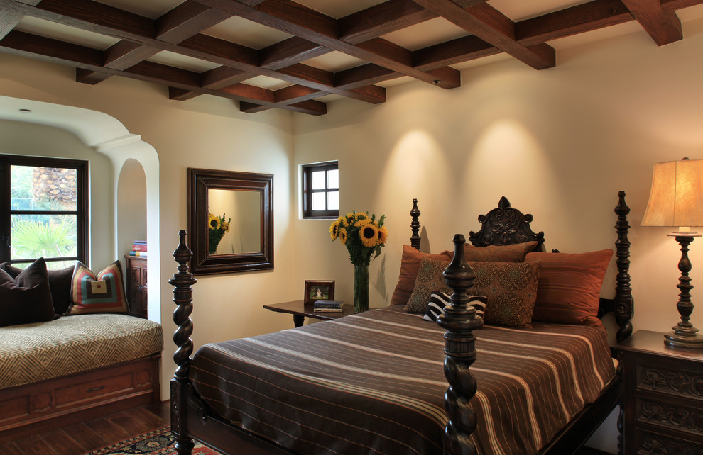 Example of a tuscan bedroom design in Phoenix with white walls