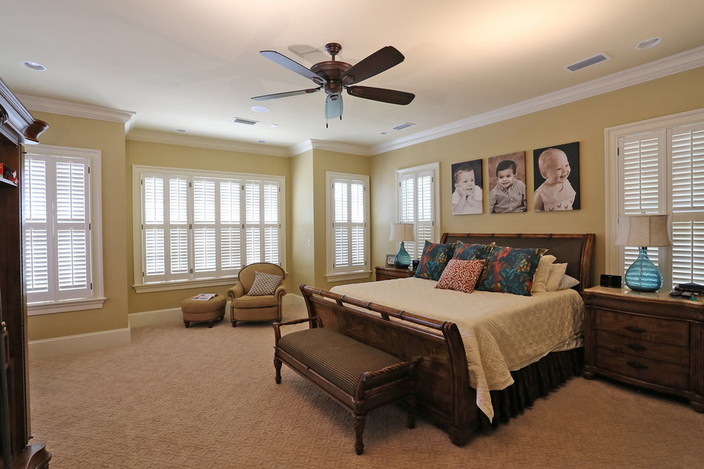 Photo of a large traditional master bedroom in San Luis Obispo with beige walls, carpet and beige floors.