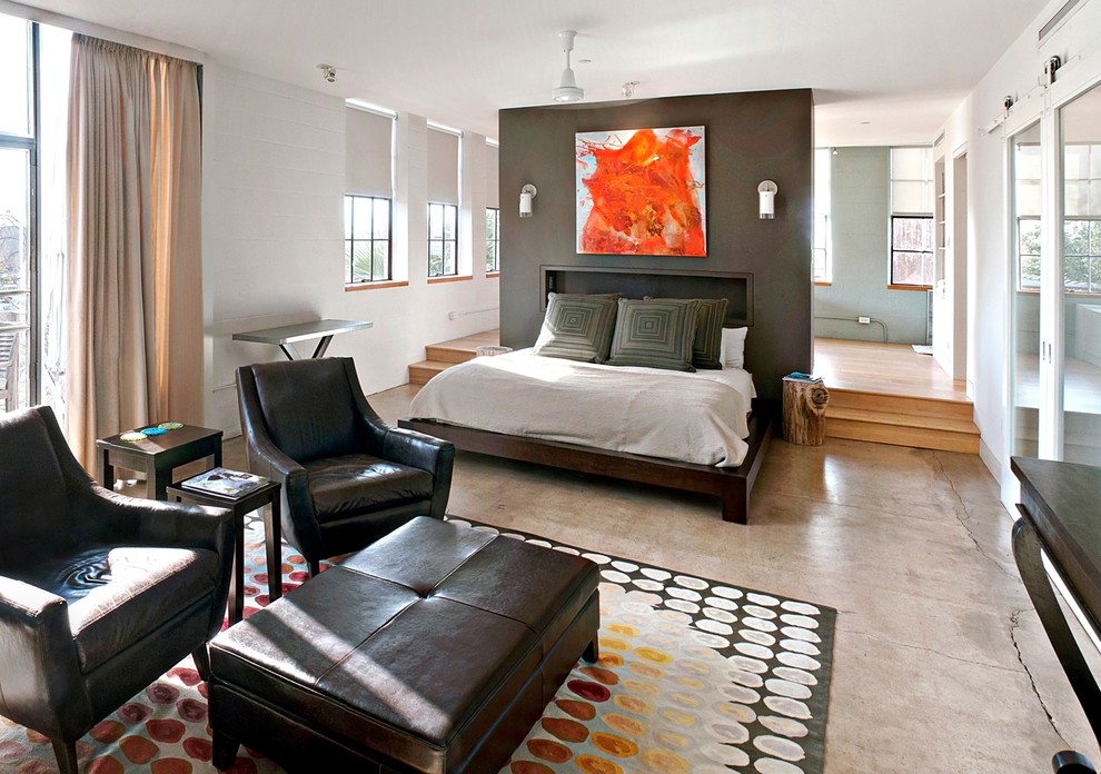 Idéer för ett modernt sovrum, med betonggolv och grått golv