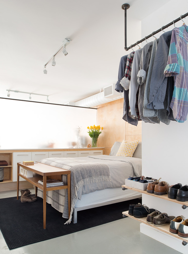 Bedroom - industrial bedroom idea in Toronto with white walls
