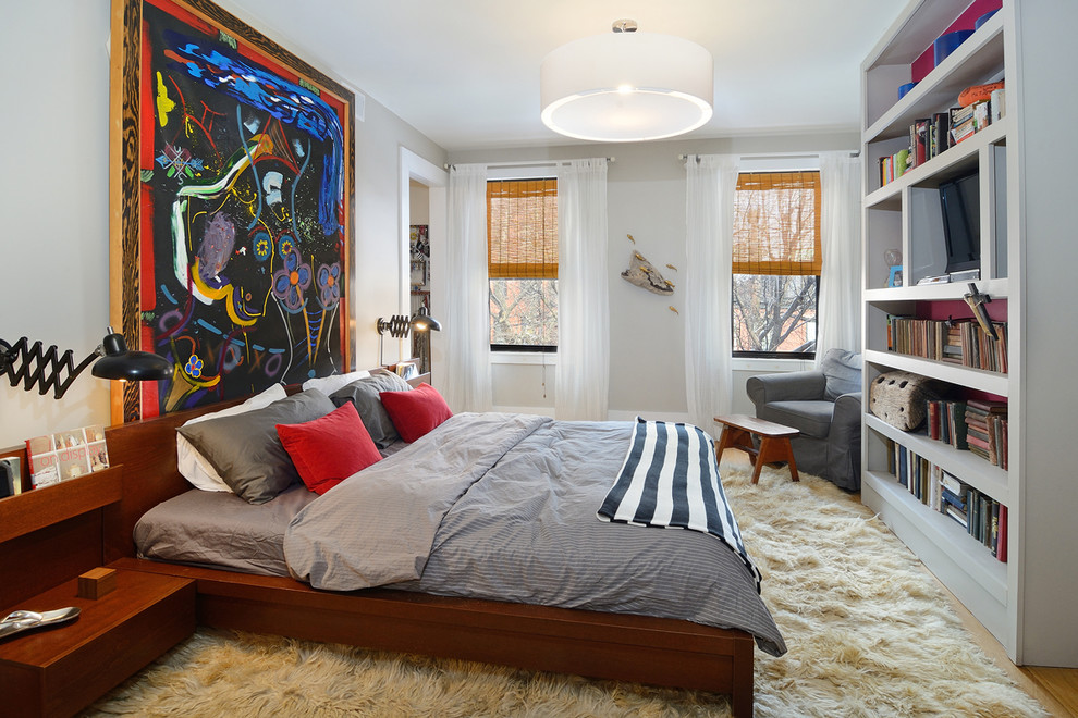 Inspiration for an eclectic bedroom in New York with grey walls.